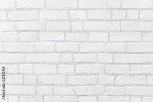 close up of weathered white brick wall texture background.