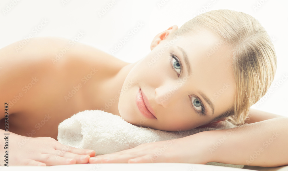 Fototapeta premium Spa portrait of young, healthy and beautiful woman isolated on white.