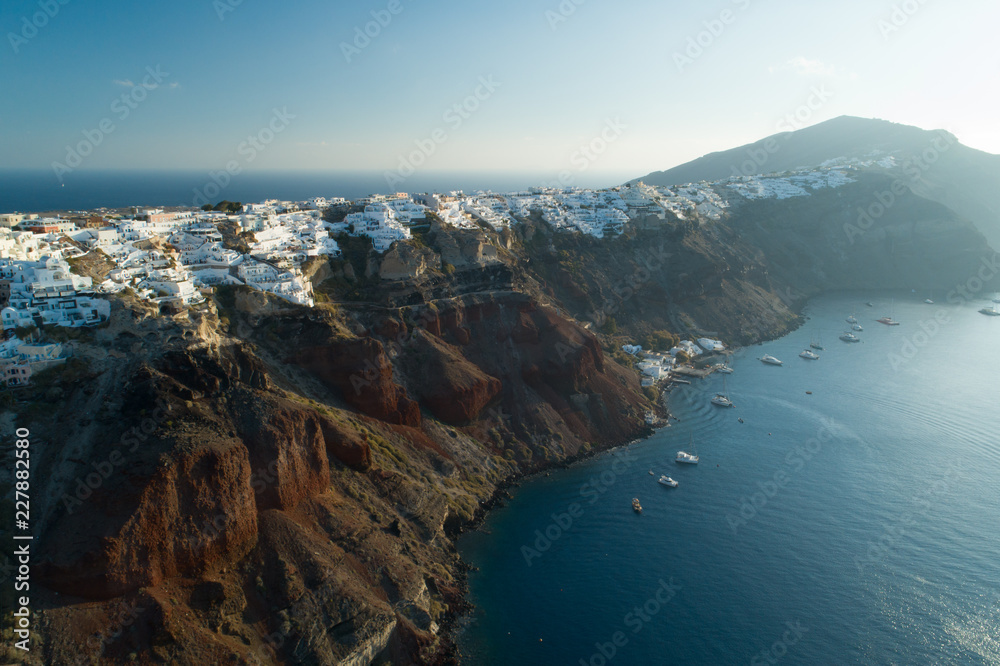 Aerial view flying over city of Oia on Santorini Greece