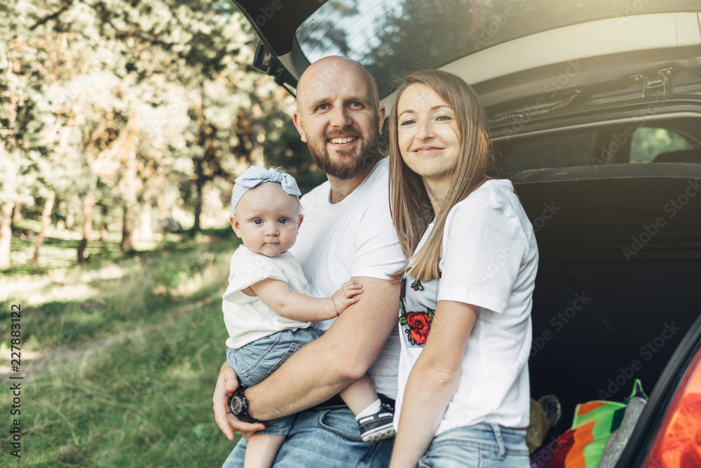 Outdoor Shot of Young Couple with Their Daughter in Love Outdoor Shot of Young Couple with Their Daughter in Love