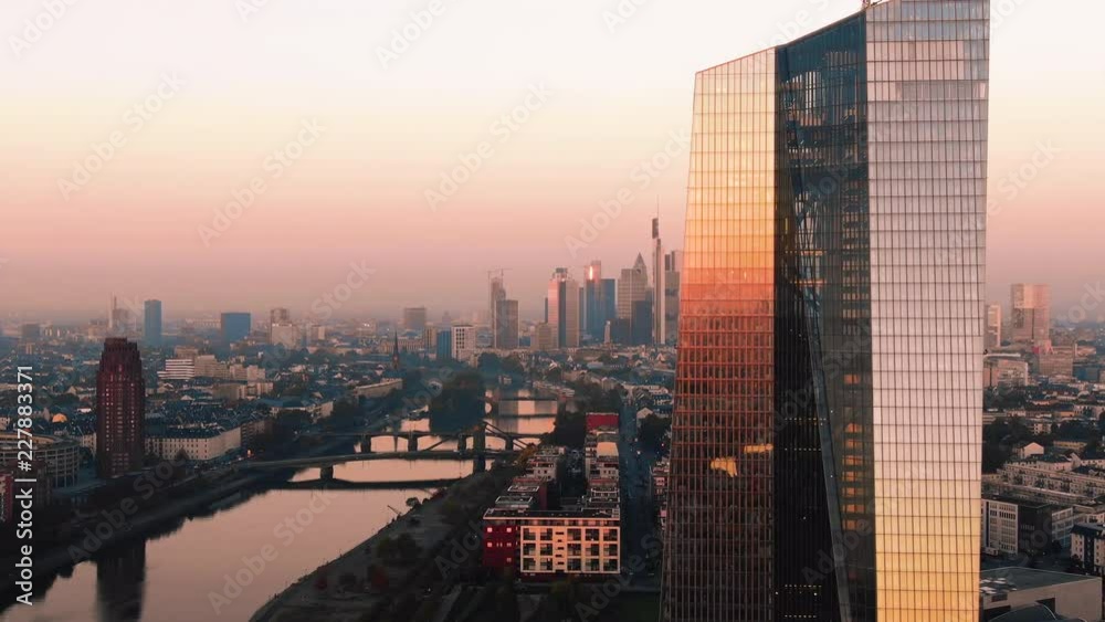 Frankfurt ECB Skyline Aerial Shot at early sunrise reflecting sun