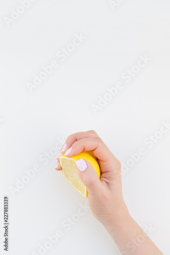 Woman hand with lemon