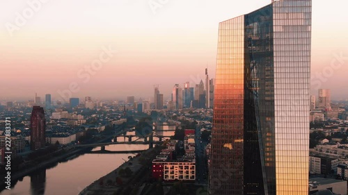 Frankfurt ECB Skyline Aerial Shot at early sunrise reflecting sun