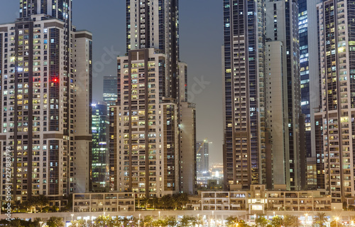 modern buildings in Dubai city, night scene. UAE