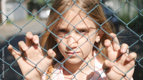 Sad Depressed Child in Abandoned, Unhappy Stray Girl Kid Orphan Looking Camera