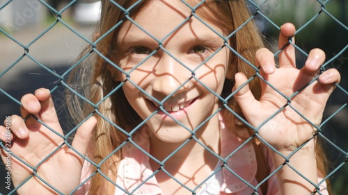Child Portrait Smiling by School Metallic Fence, Happy Little Girl Face Laughing