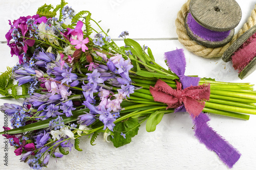 Colorful bouquet with spring wild  hyacints and another meadow flowers photo