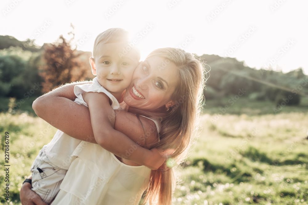 Fototapeta premium Happy Mother and Son Having Fun, Enjoying Sunny Summer Day