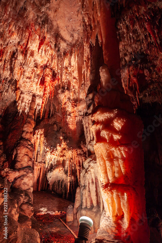 Big stalactites hanging down limestone cave ceiling