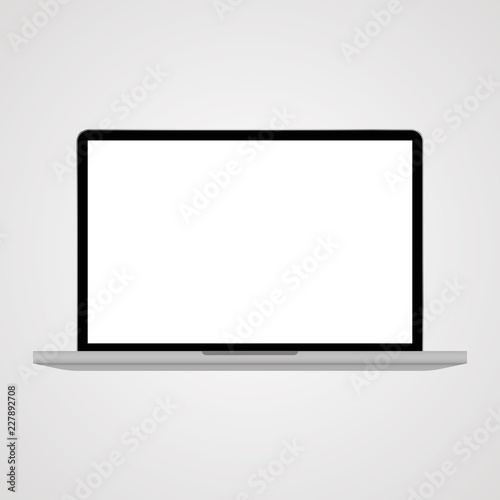 Realistic laptop on grey back