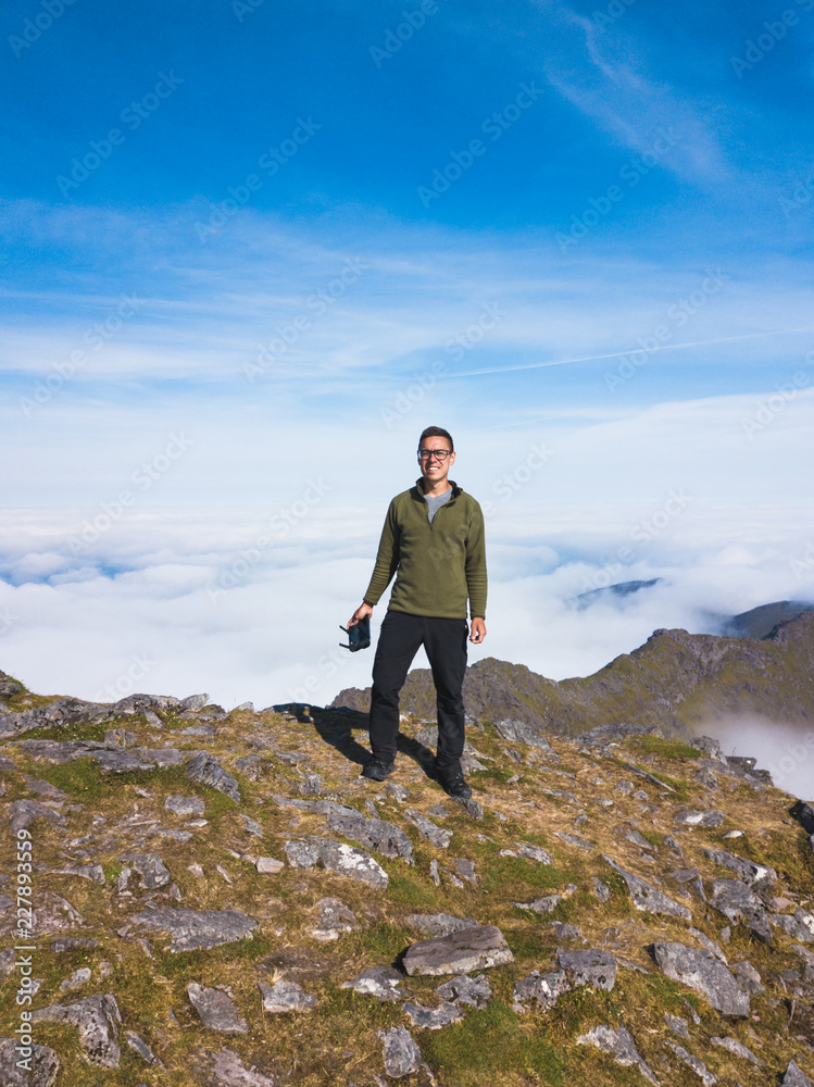 Obraz premium The man on the top of Carrauntoohil. Aerial view