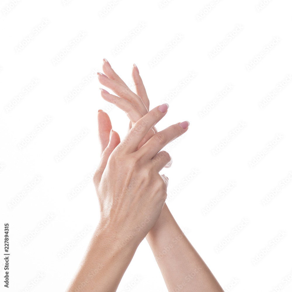 Young woman touching her hand and feeling moisturizing effect of cream on white background. Young woman touching her hand and feeling moisturizing effect of cream on white background.