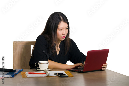 corporate company portrait of young beautiful and busy Asian Korean businesswoman working at office computer desk concentrated in business success