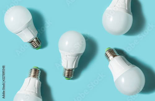 LED light bulbs on blue color background. Flat lay. Pattern. photo