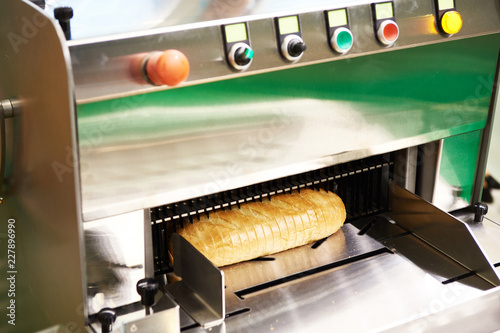 Sliced bread in cutting machine photo