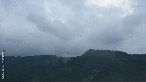 landscape of fogt floating on mountain peak photo