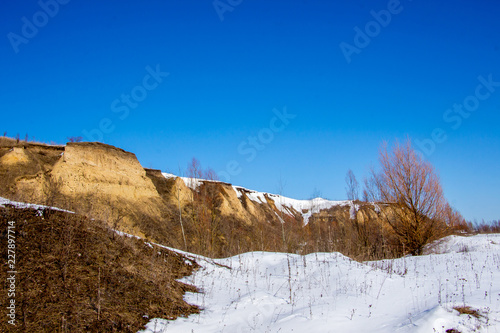 Winter landscape. Sandy rock covered with snow_ © Volodymyr
