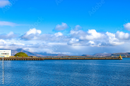 harbor in Iceland with blue water and sky © Jaimie Tuchman