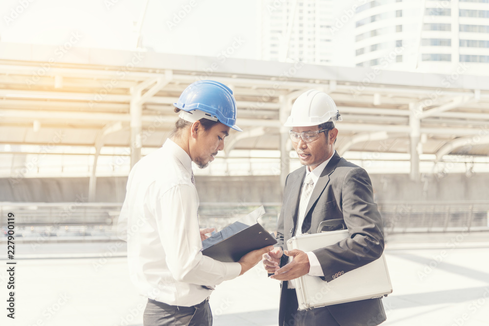 Business teamwork discussing on site. Interior design consulting with building contractor. Engineering Concept. Business teamwork discussing on site. Interior design consulting with building contractor. Engineering Concept.