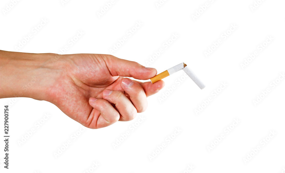 Hand holding a broken cigarette. Close up. Isolated on white background Hand holding a broken cigarette. Close up. Isolated on white background