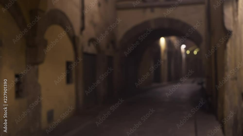 Blurred background plate of arches on an empty street Blurred background plate of arches on an empty street