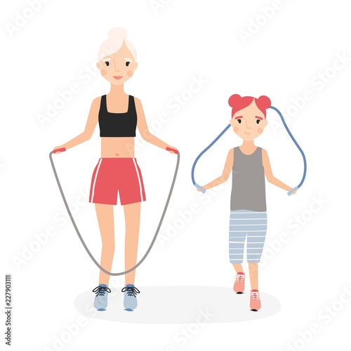 Mom and daughter jumping skipping ropes during fitness workout