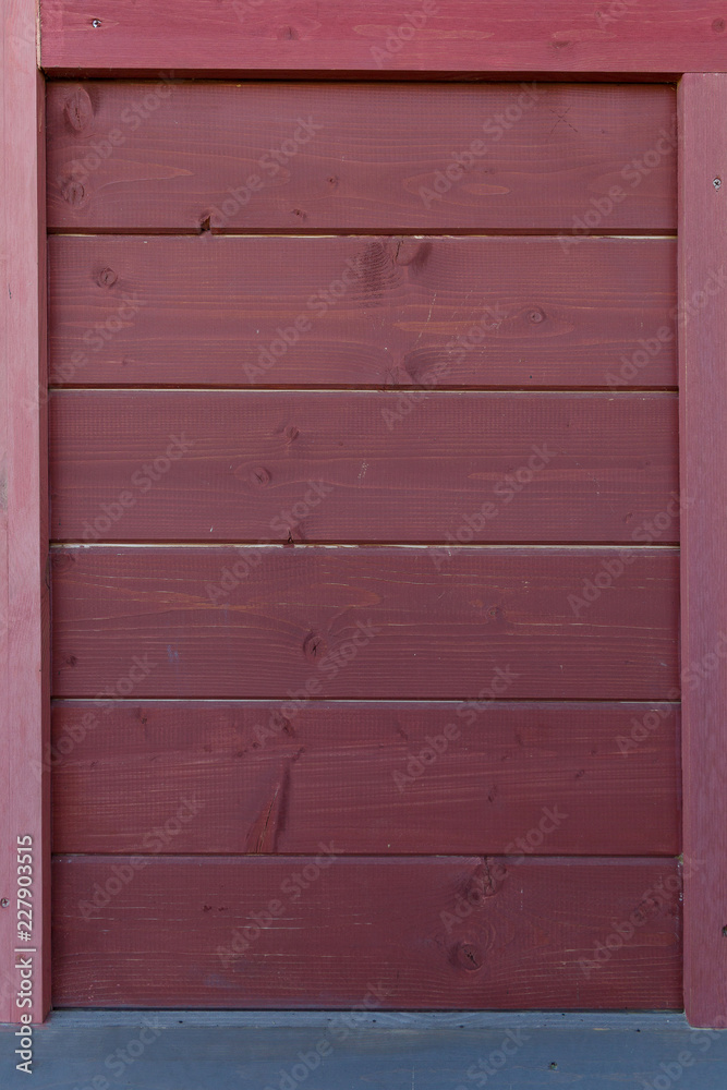 A wooden texture made of dark burgundy color horizontal boards. A wooden texture made of dark burgundy color horizontal boards.