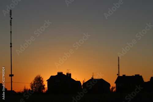 silhouette of buildings at sunset