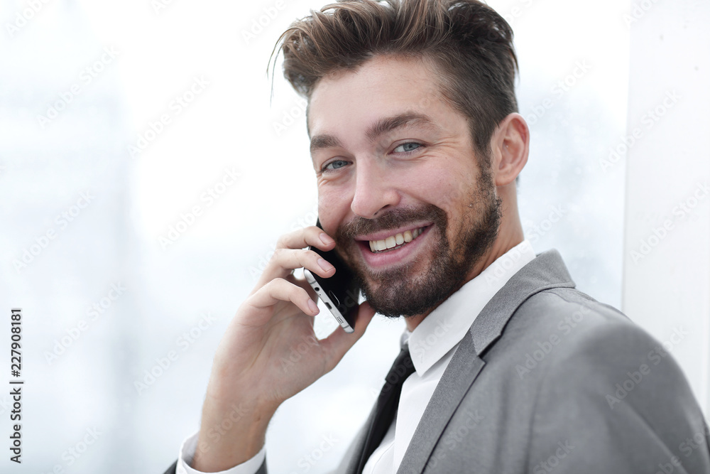 Business man talking on mobile phone Business man talking on mobile phone