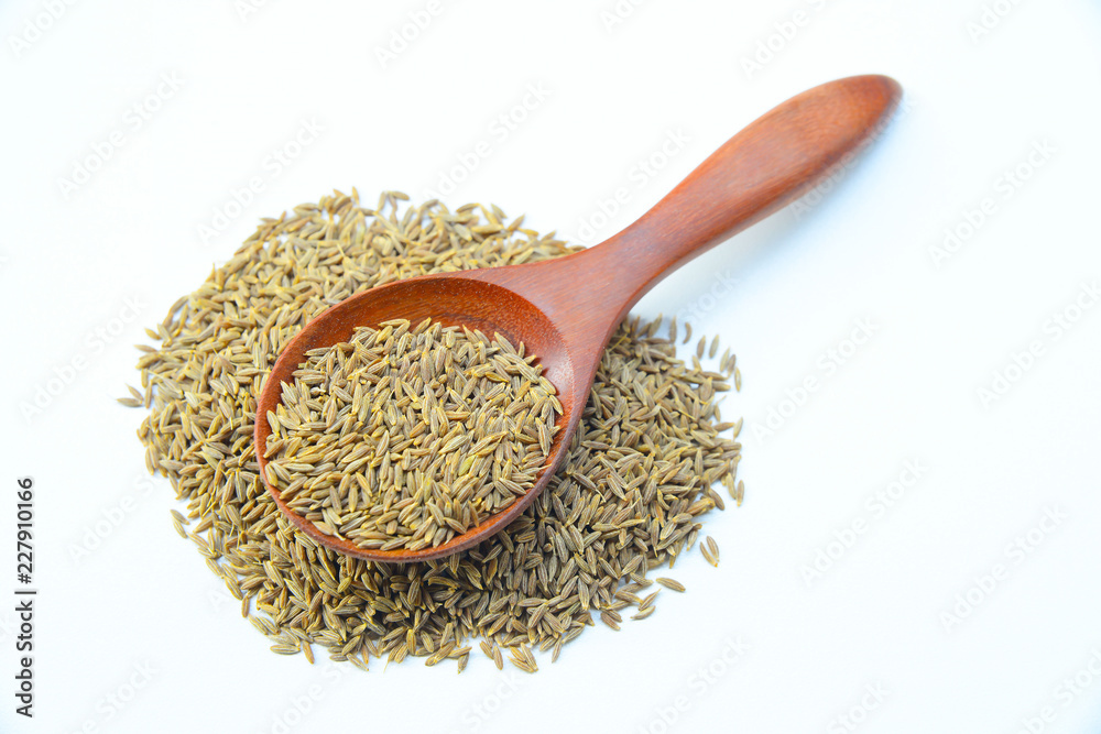 Cumin or caraway seeds in Wooden spoon on White background
Cumin or caraway seeds in Wooden spoon on White background