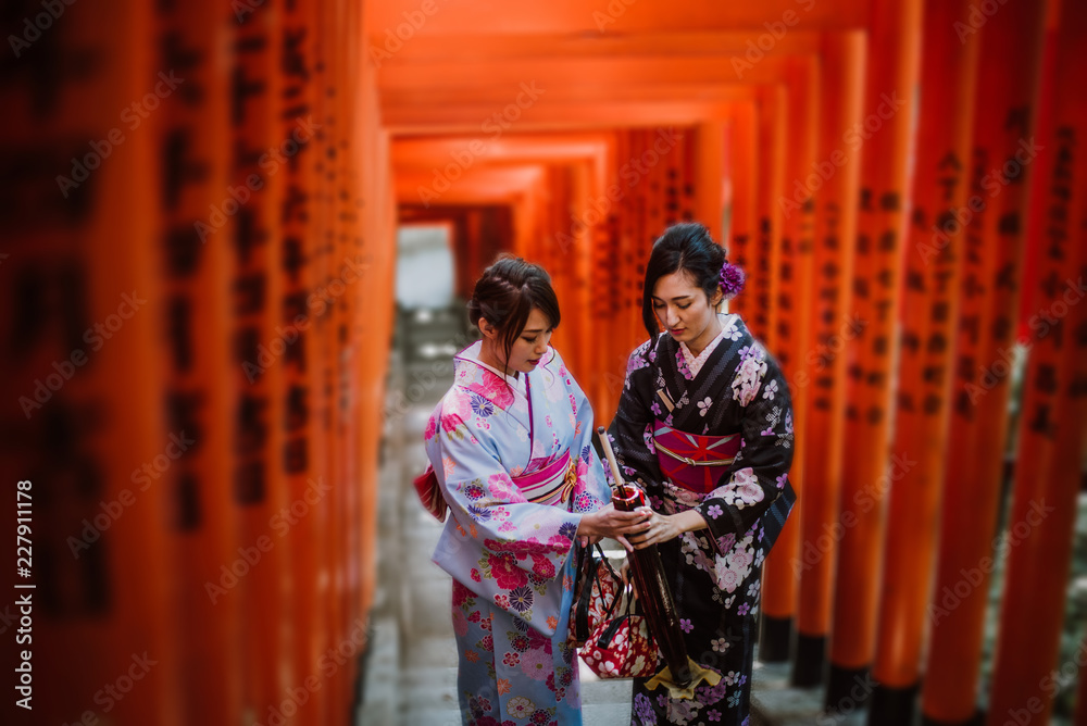 Two japanese girls wearing kimonos traditional clothes, lifestyle moments Two japanese girls wearing kimonos traditional clothes, lifestyle moments