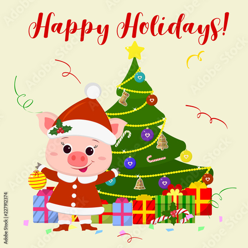 Happy New Year and  Christmas  card. A cute pig in a Santa Claus costume is standing next to a tree and holding a Christmas ball. The symbol of the new year in the Chinese calendar. 2019. Vector © LanaMay