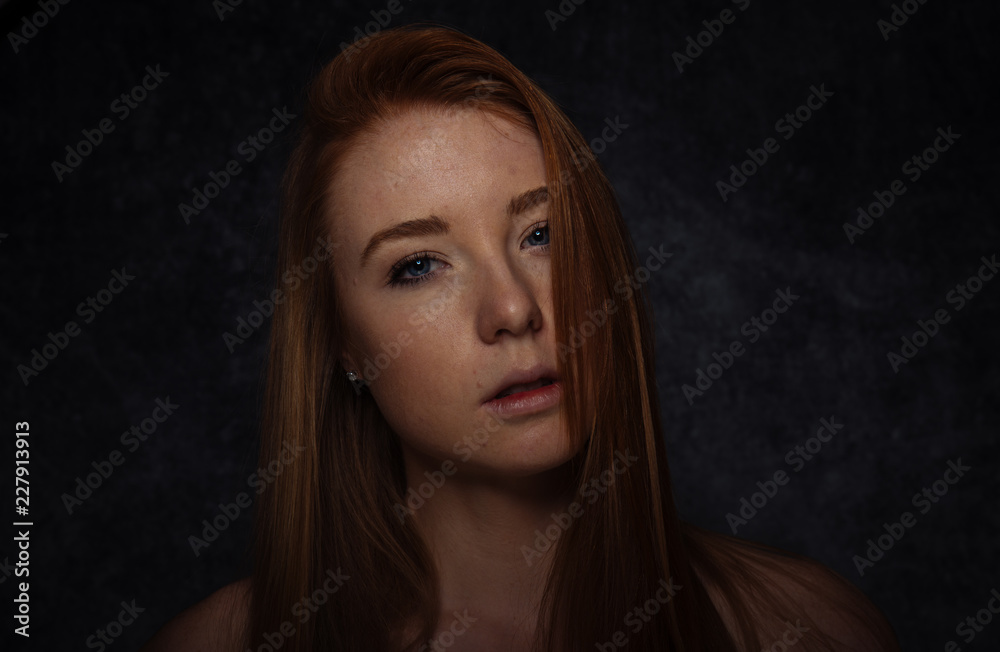 Studio portraits with red hair girl