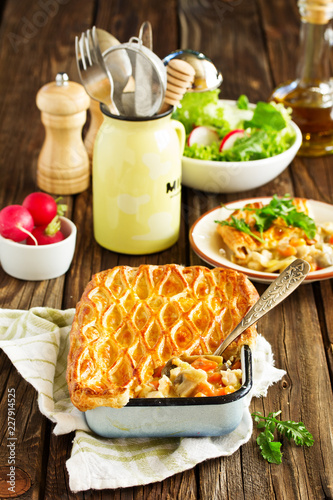 American chicken pie with vegetables in puff pastry.