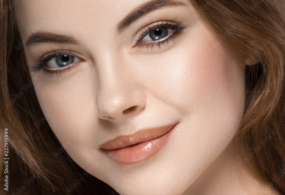 Beautiful woman face with make up and beauty healthy skin and hair portrait. Studio shot. Beautiful woman face with make up and beauty healthy skin and hair portrait. Studio shot.