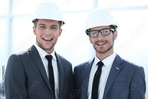 two builders are looking into the camera. concept of constructio