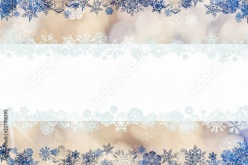 Christmas card with snowflakes and place for greetings on on a blurry gold-white-blue background. Сhristmas, New Year winter composition, top view, flat lay, with copy space