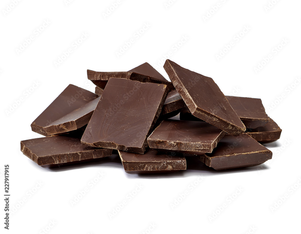 Broken chocolate blocks stack pile isolated on white background Broken chocolate blocks stack pile isolated on white background