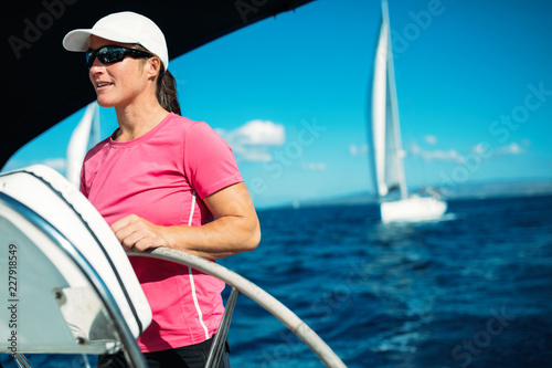 Happy strong woman sailing with her boat © NDABCREATIVITY