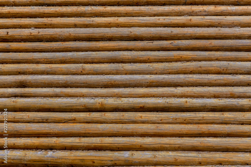 Log wall. Background of wooden logs. Wood texture. Log wall. Background of wooden logs. Wood texture.