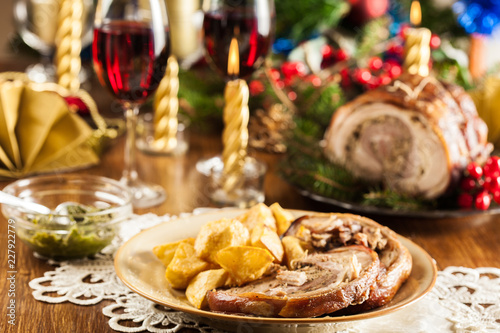 Traditional italian porchetta on festive table