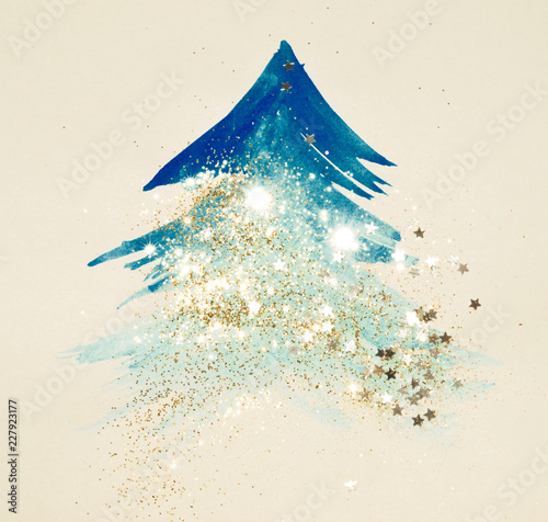 Glitter and glittering stars on abstract blue watercolor Christmas tree in vintage nostalgic colors.