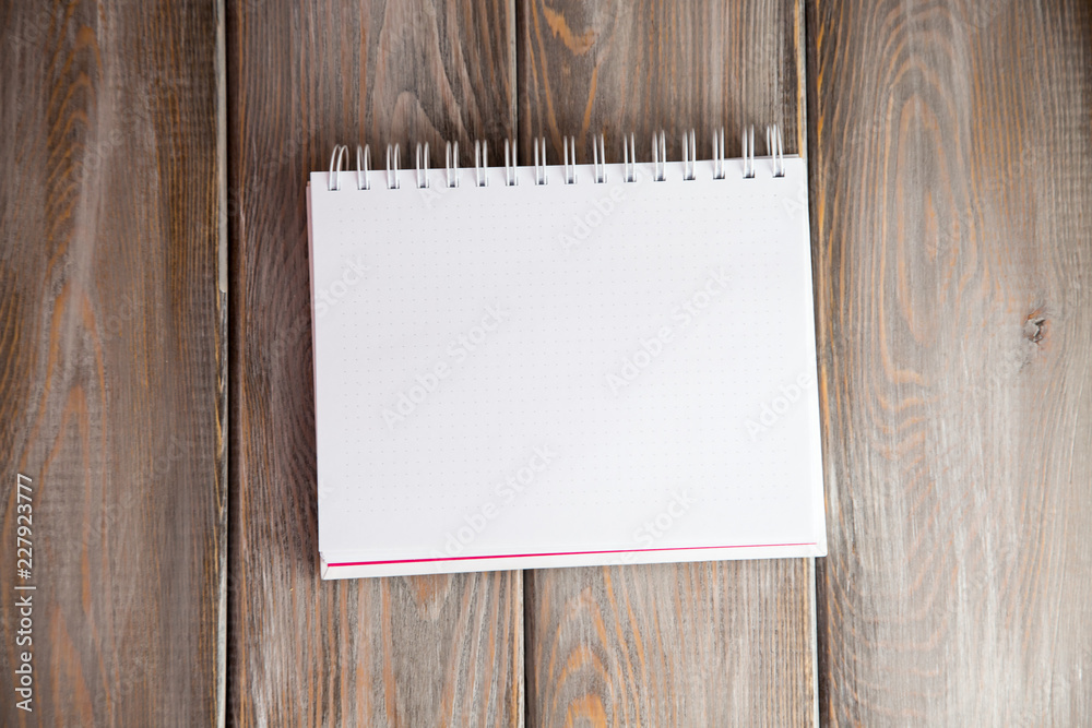 notebook on a wood background. Layout for inserting text and image notebook on a wood background. Layout for inserting text and image