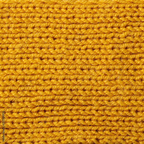Yellow knitted wool texture background pattern with high resolution. Top view. Copy space.
