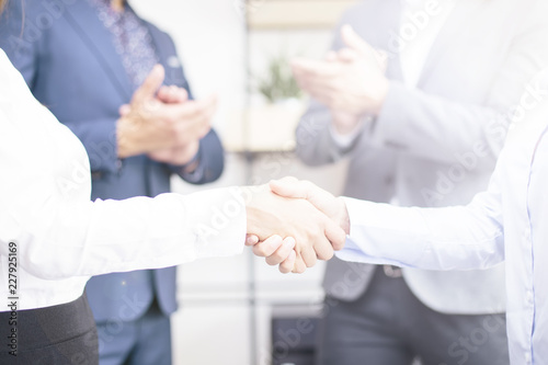 Businesswomen making deal a...