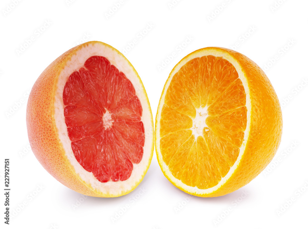 Half juicy grapefruit and orange on a white background Half juicy grapefruit and orange on a white background