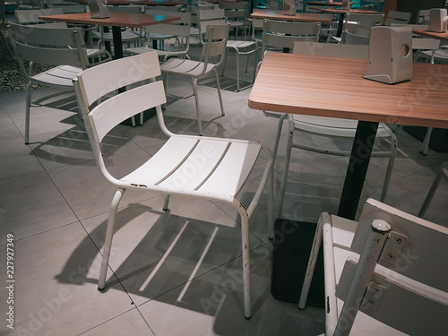 Empty Dining table and chairs for people In the restaurant.