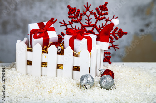 Christmas gifts and decorations in a white box