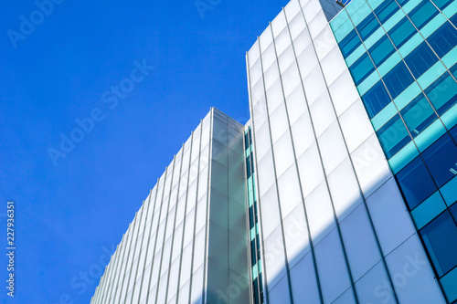 Modern office building with blue skies.