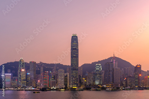Hong Kong cityscape at sunset, long exposure photography for boat movement